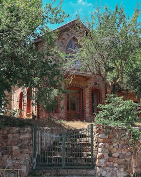 Charming historic stone house nestled among trees in İstanbul, Turkey.
